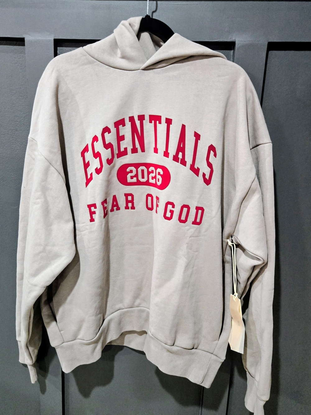 Fear of God ESSENTIALS 2026 Beige Hoodie with Red Logo